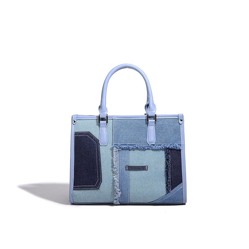 Stylish blue handbag with denim patchwork design, featured in the 2025 Fall Series Sales.