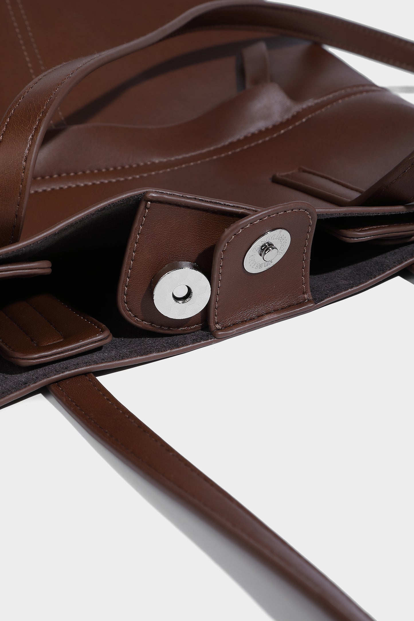 Magnetic button, inside with the main bag side pocket, very convenient to load things.