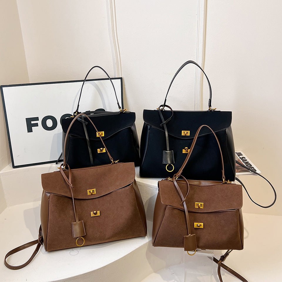 Vintage chamois leather tote bag collection featuring brown and black options on display.