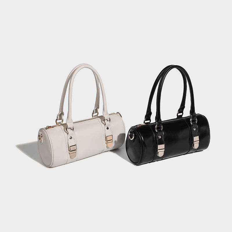 Chic baguette bag in white and black showcasing stylish design and modern appeal for fashion enthusiasts.