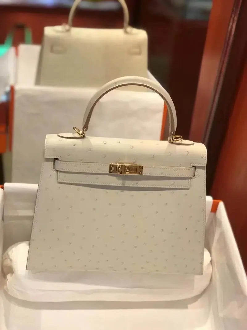 Ostrich leather report showcasing a stylish white handbag with elegant design and detailed texture.
