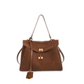 Vintage chamois leather tote bag with adjustable strap and gold hardware, perfect for fall and winter seasons.