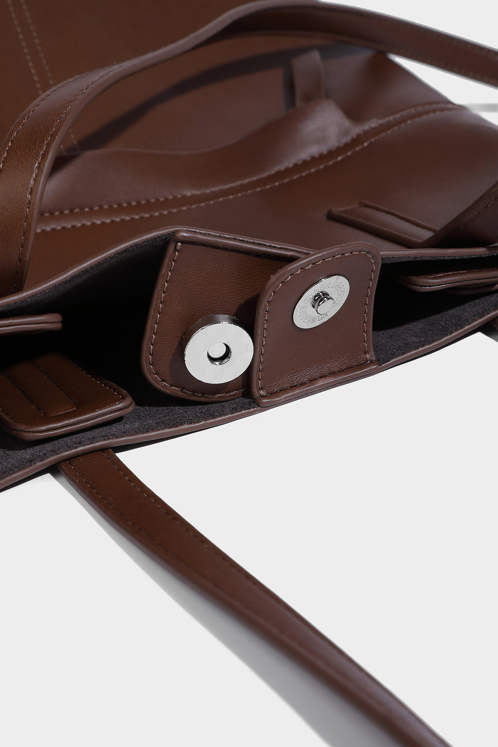 Magnetic button, inside with the main bag side pocket, very convenient to load things.