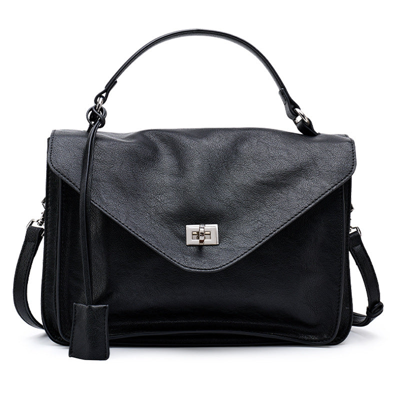 classic elegance tote bag in black leather with a sleek design and adjustable strap.