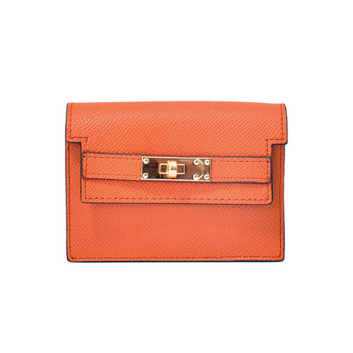 Elegant leather card bag in orange with refined hardware and meticulous stitching.