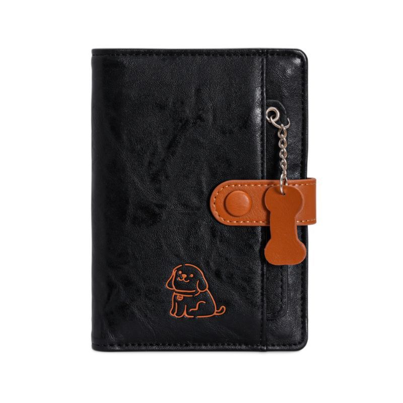 Puppy passport holder featuring a charming dog design, compact wallet with card slots and pen compartment.