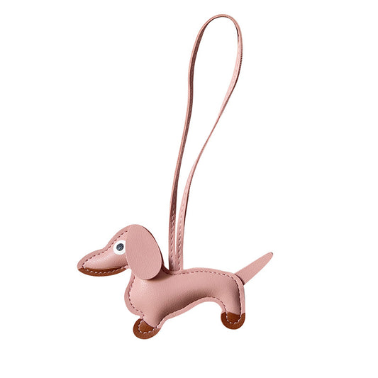 this adorable leather puppy bag pendant is the perfect accessory for any dog lover. 