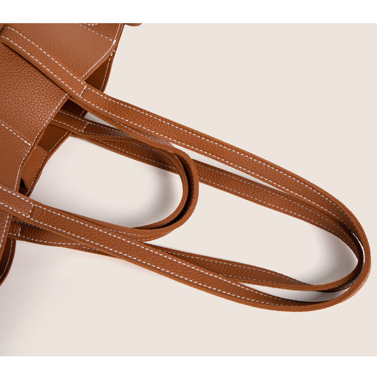 Close-up of the straps on the 2025 winter vintage tote bag, showcasing its soft material and elegant design.