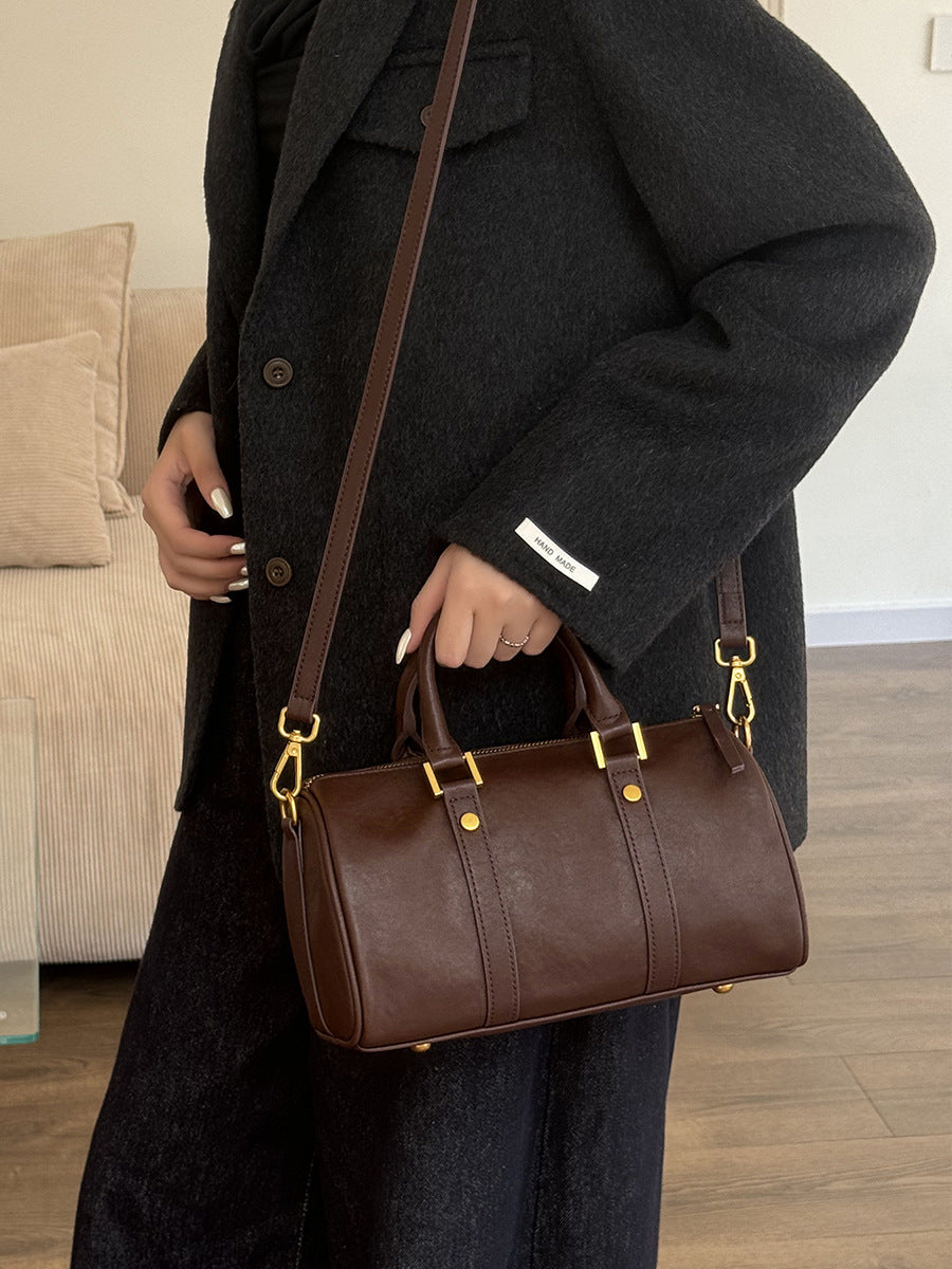 Leather vintage boston bag in use, showcasing its elegant design and premium quality leather.