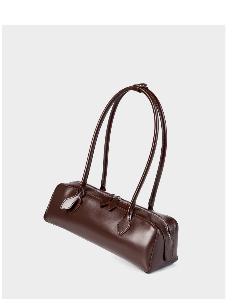 2025 Winter Leather Baguette Bag in rich brown with elegant handles and structured design, showcasing timeless style.