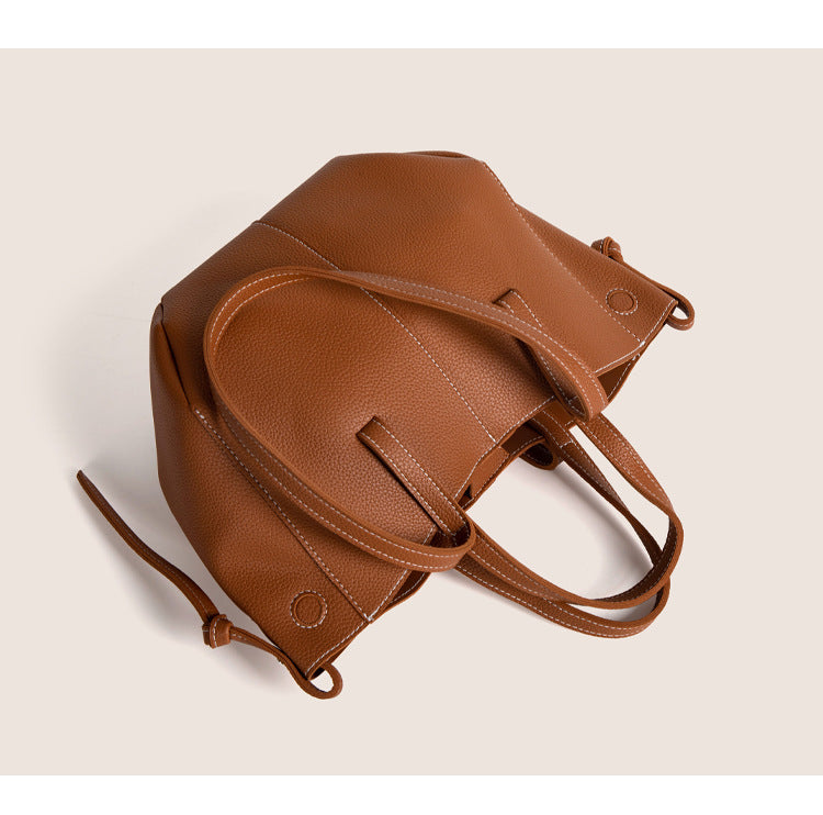 2025 winter vintage tote bag in rich brown leather with comfortable handles and spacious design for daily essentials.