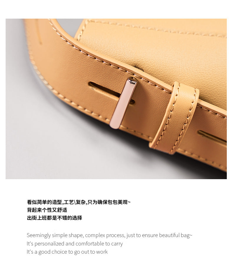 Close-up of the adjustable strap of a genuine leather bucket bag, showcasing its sleek design and premium materials.
