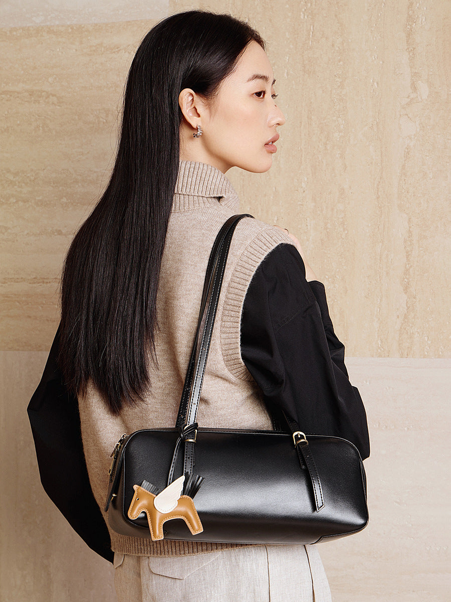 leather bowling handbag from the Dreamland Series, featuring premium full-grain leather and exclusive charm.