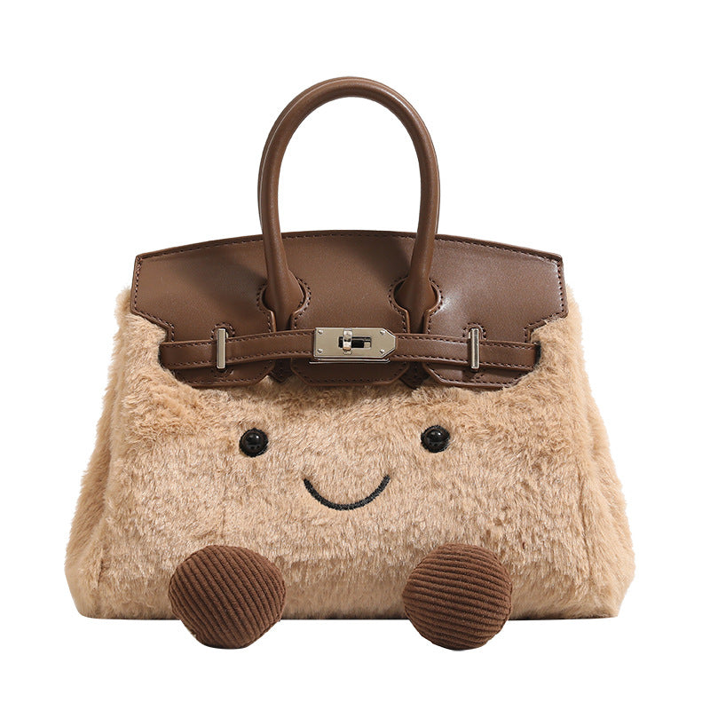 Woolen handbag for winter featuring a cute design with a smiling face and brown leather accents.