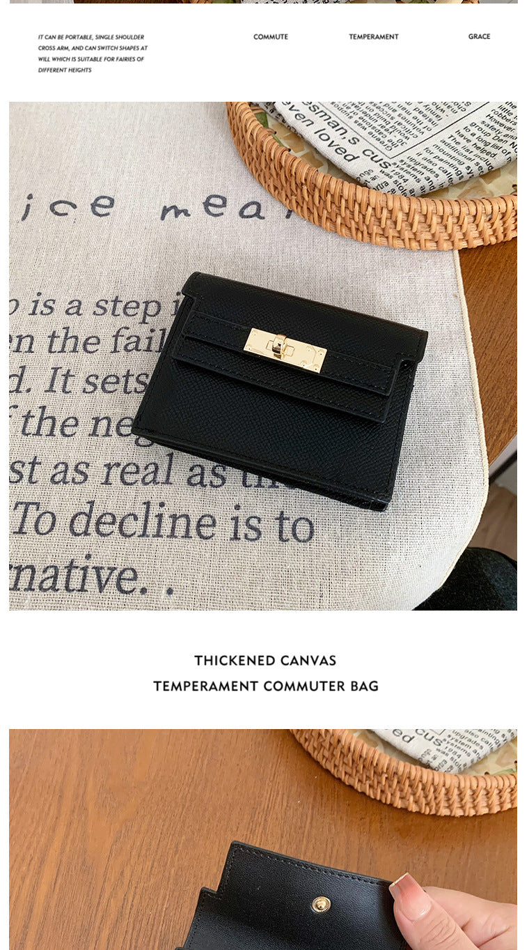 Elegant leather card bag resting on a table with a decorative placemat and a woven basket, showcasing luxury and style.