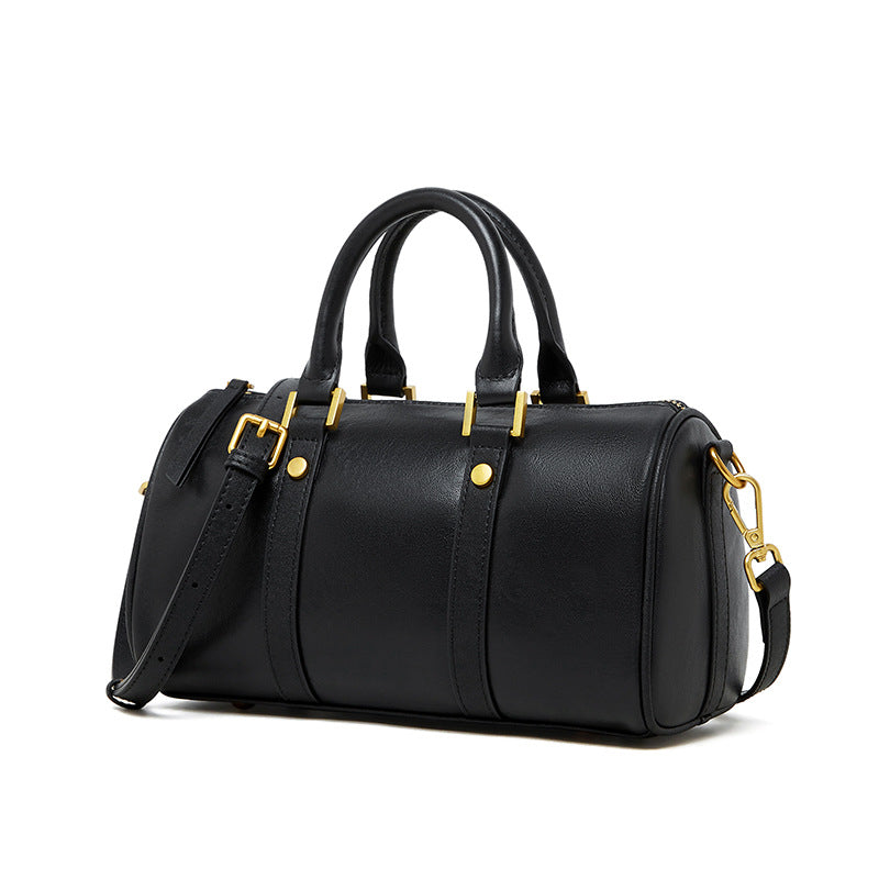 leather vintage boston bag in black with gold accents and detachable strap