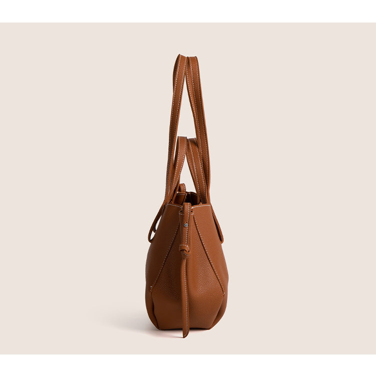 2025 winter vintage tote bag in brown with dual straps and a textured finish, perfect for modern professionals.
