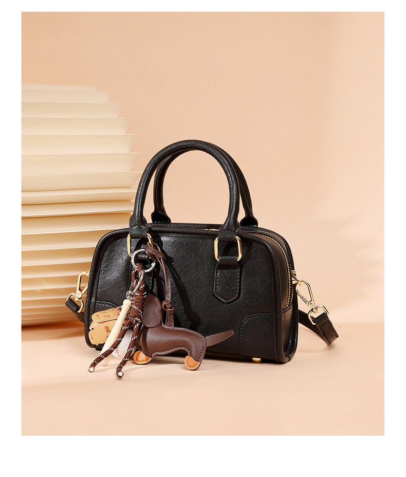 classic leather Boston bag with unique keychain and stylish design for everyday use